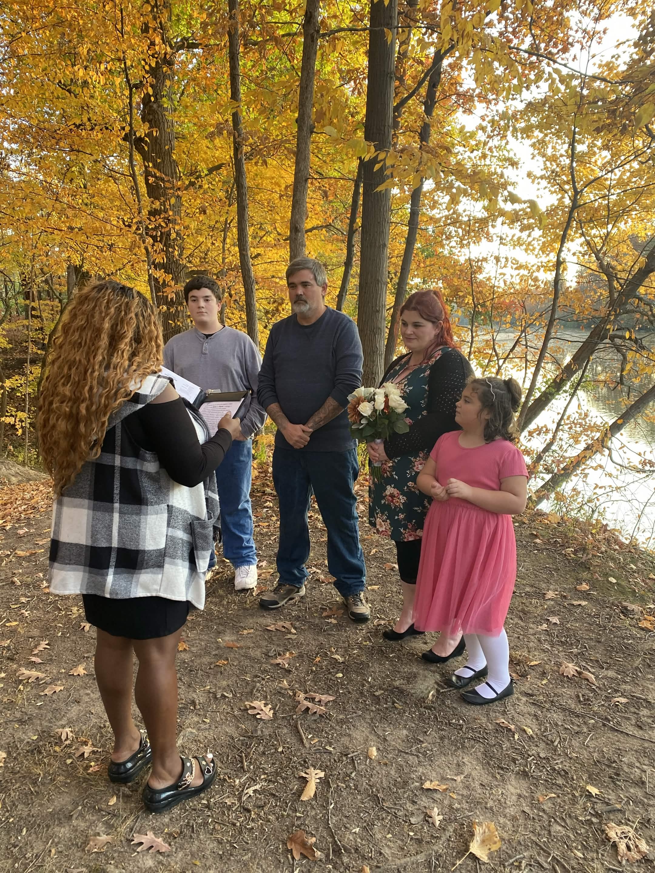 An autumn riverside family ceremony