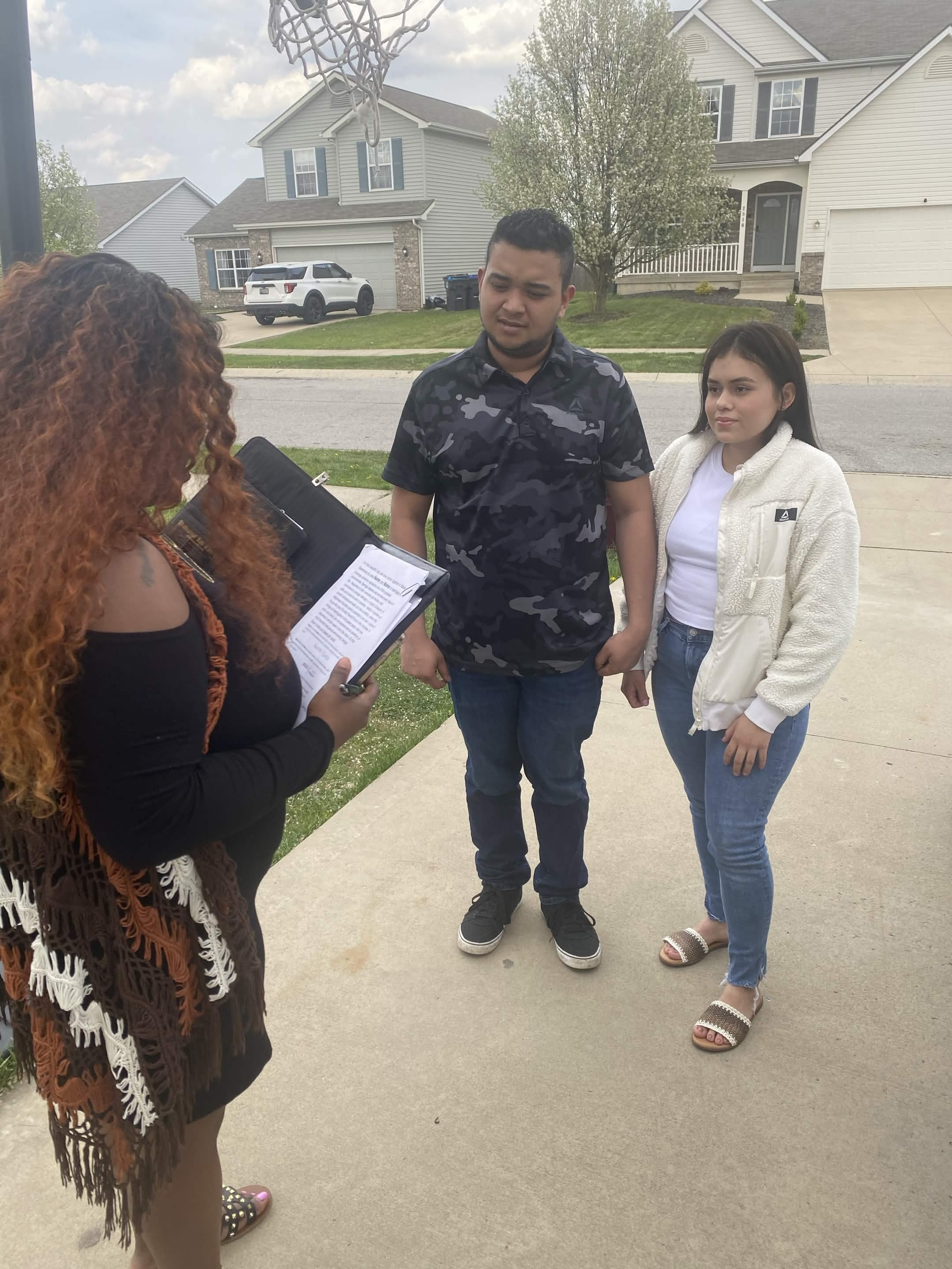 Angelica reading vows for a couple at their home elopement